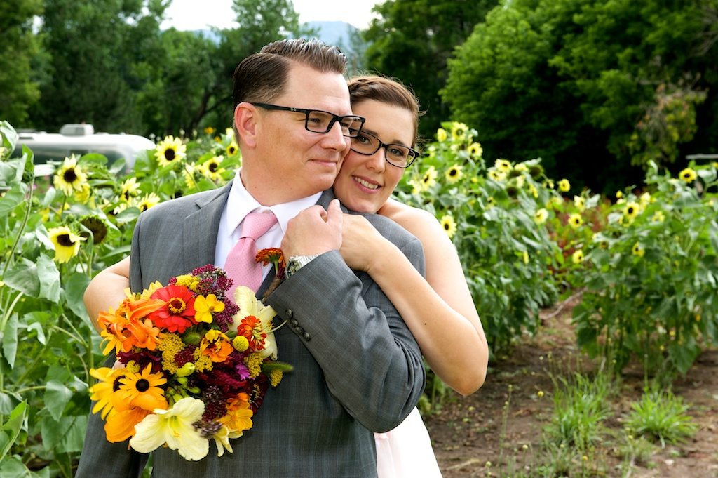 Bride & groom posing at Lyons Farmette wedding in Lyons, CO