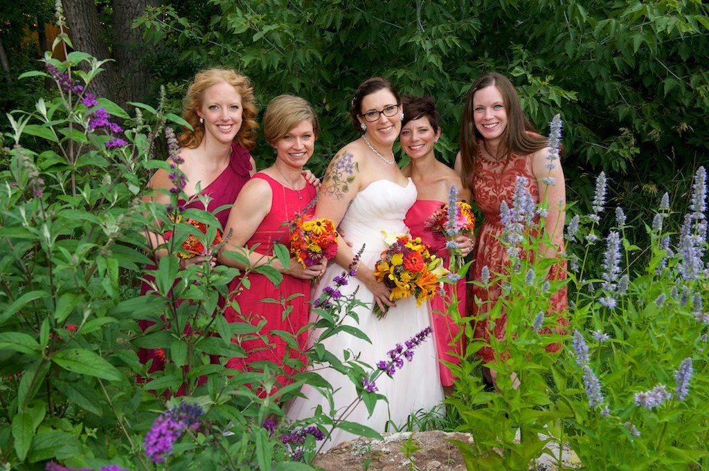 Bridal party posing with bride at Lyons Farmette wedding in Lyons, CO
